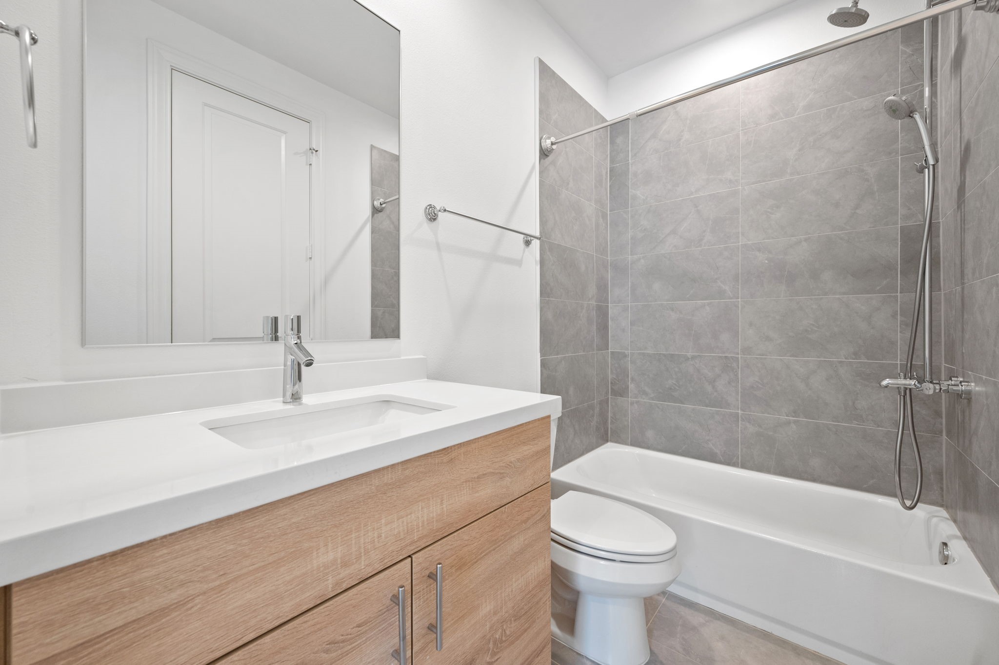 614 Delmar Street Houston, TX 77023 - Photo 21 of 36 a bathroom with a sink a toilet and shower