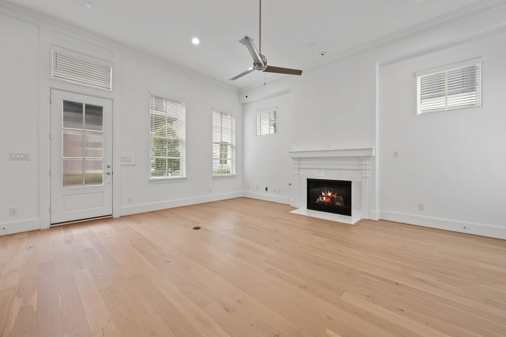 614 Delmar Street Houston, TX 77023 - Photo 4 of 36 a view of empty room with wooden floor and fireplace