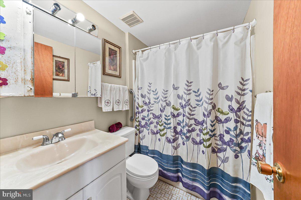 15 Colonial Circle Aston, PA 19014 - Photo 14 of 30 a bathroom with a sink toilet and shower