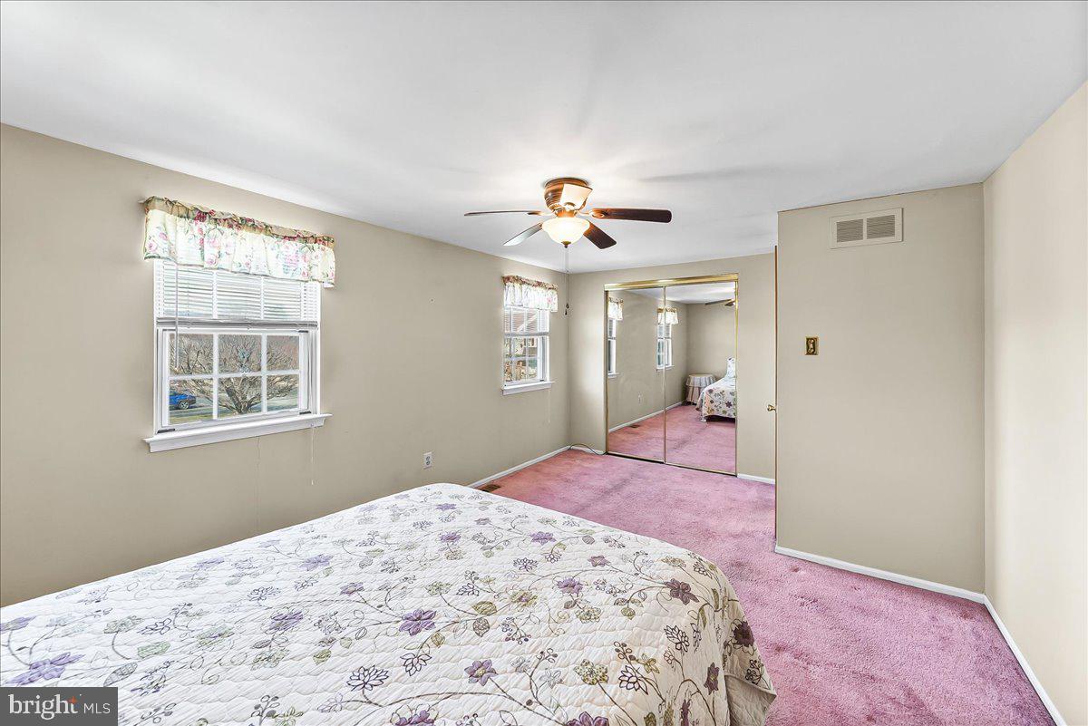 15 Colonial Circle Aston, PA 19014 - Photo 16 of 30 a bedroom with a bed and a chandelier