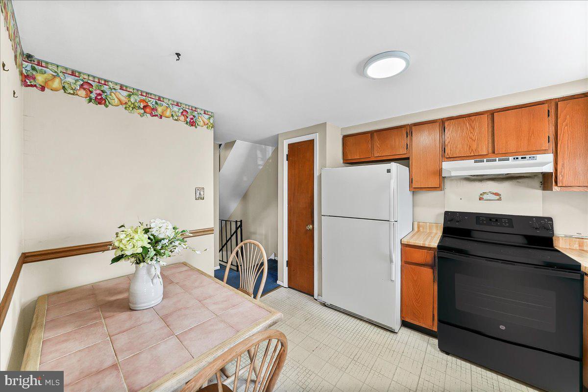 15 Colonial Circle Aston, PA 19014 - Photo 8 of 30 a kitchen with a refrigerator and a white cabinets