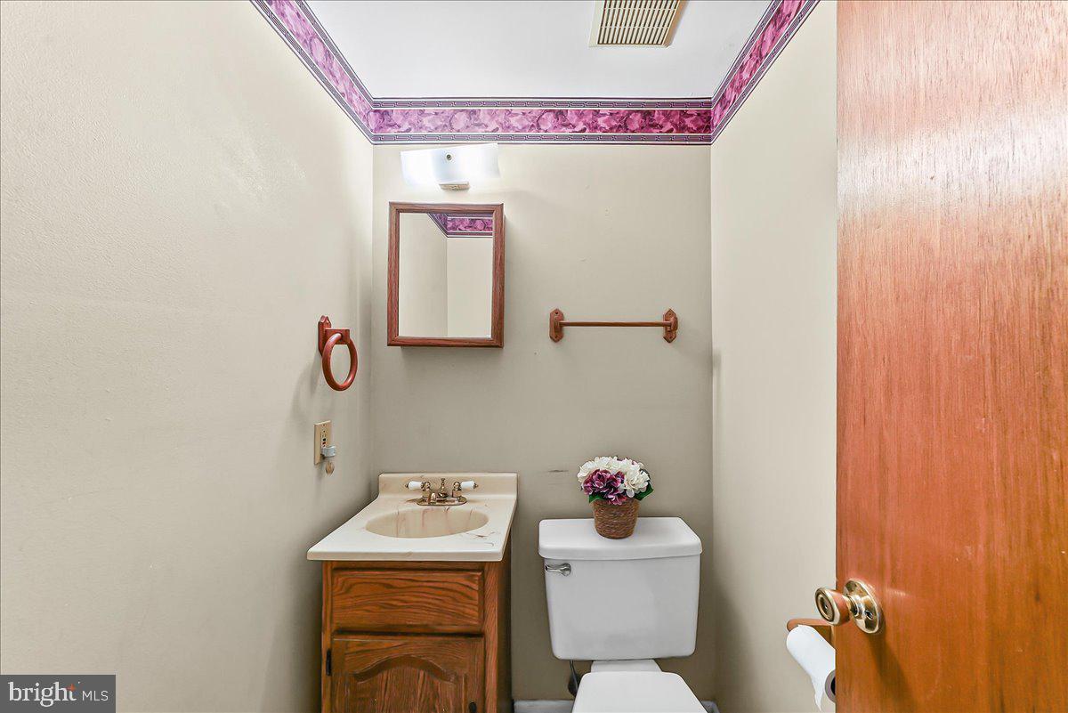 15 Colonial Circle Aston, PA 19014 - Photo 9 of 30 a bathroom with a sink toilet and a mirror