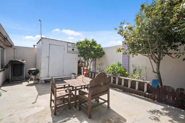 a view of a chairs and table in the patio