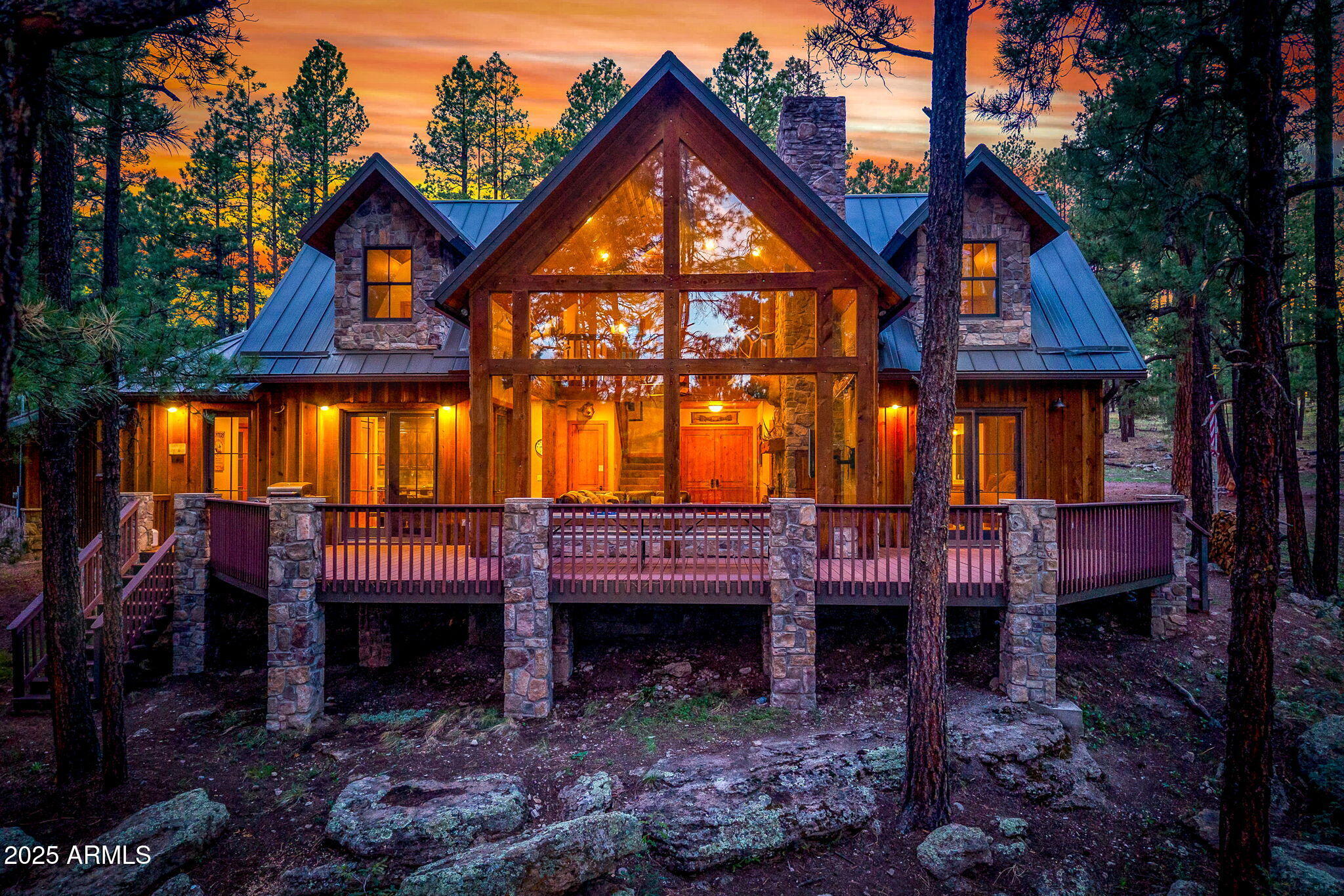 36 County Road N2147 Alpine, AZ 85920 - Photo 1 of 47 a front view of a house with balcony and wooden fence