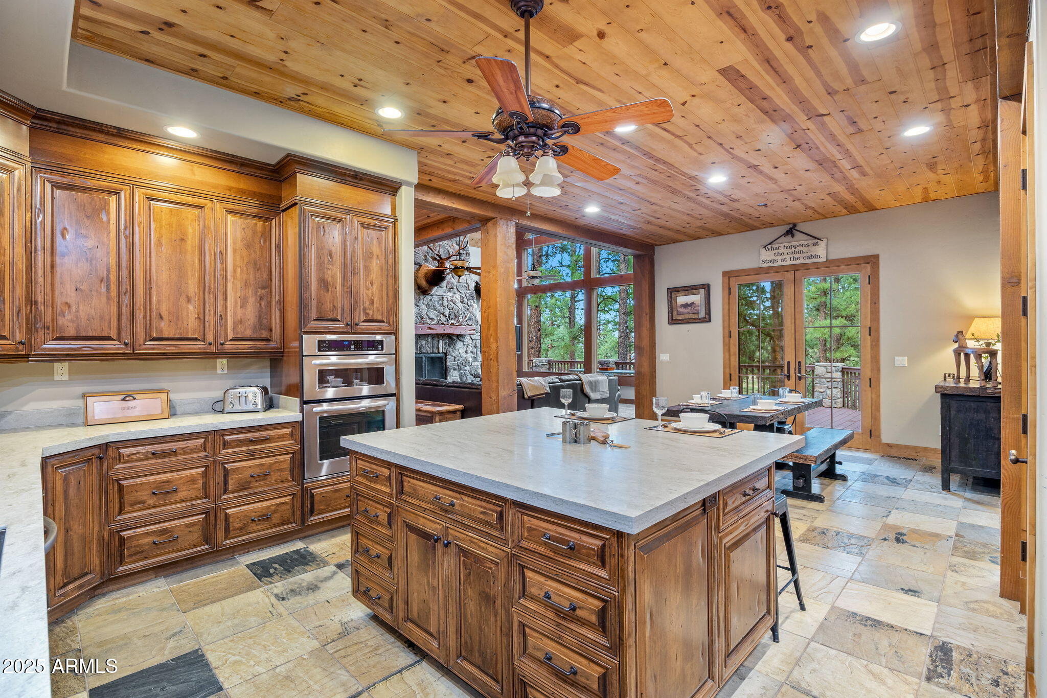 36 County Road N2147 Alpine, AZ 85920 - Photo 16 of 47 a kitchen that has a lot of cabinets in it and wooden floors