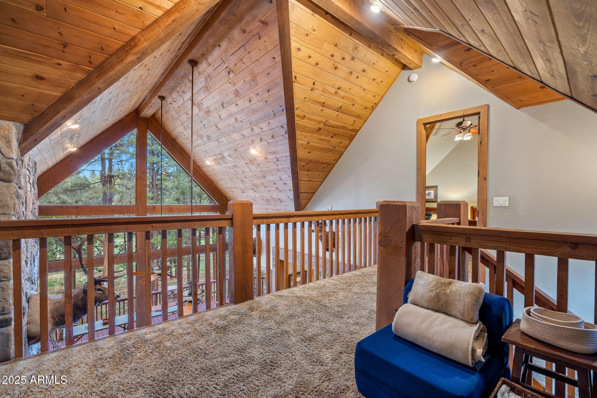 36 County Road N2147 Alpine, AZ 85920 - Photo 24 of 47 a balcony with wooden floor stairs and furniture