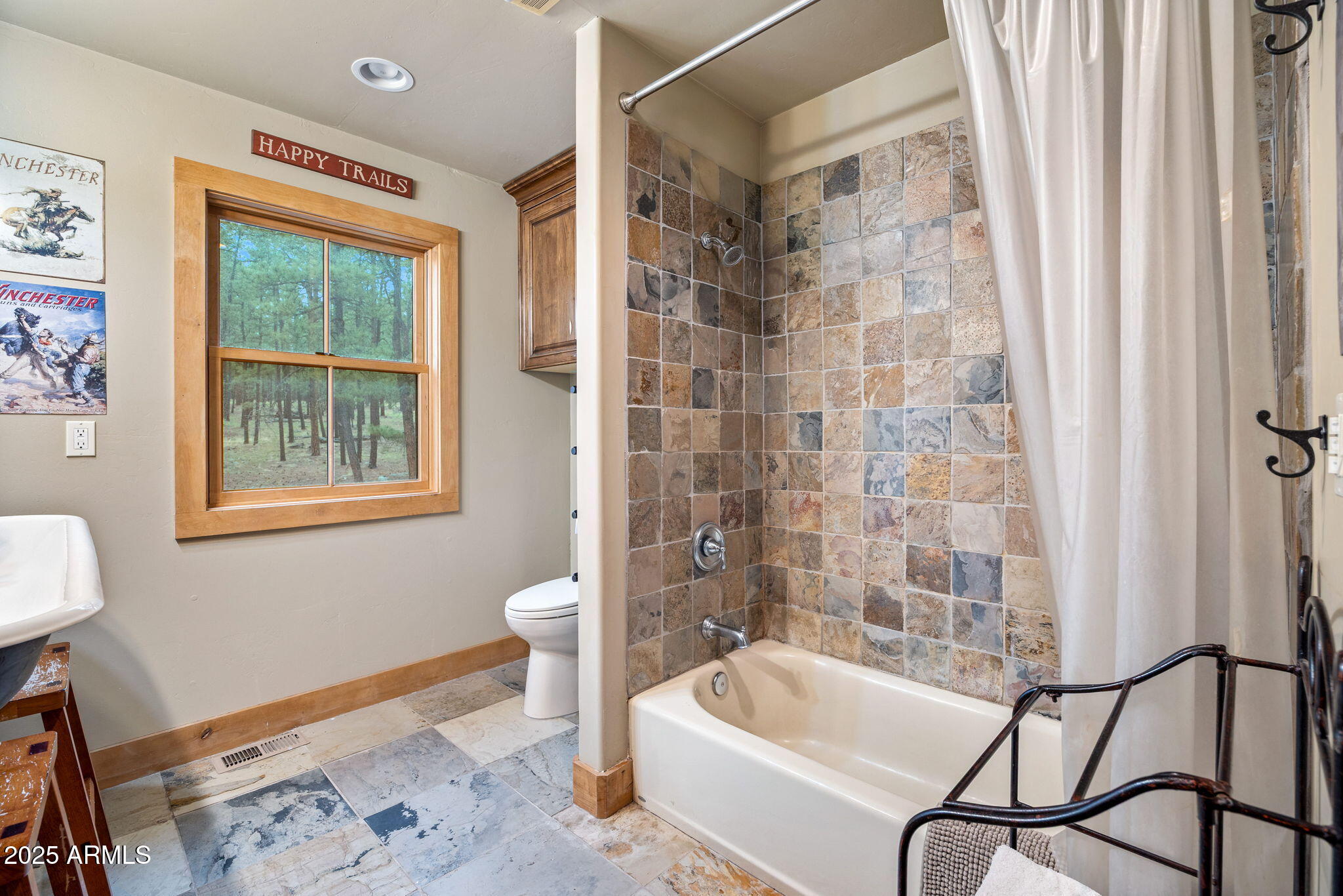 36 County Road N2147 Alpine, AZ 85920 - Photo 27 of 47 a bathroom with a sink a bathtub and a window