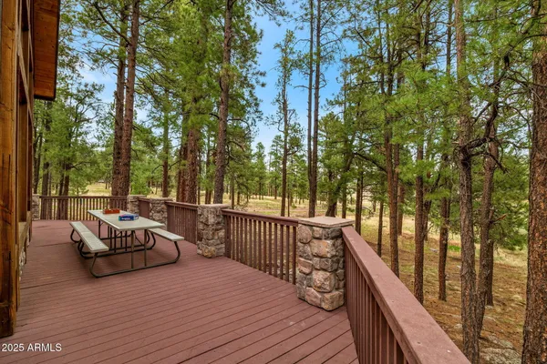 a view of a house with wooden deck