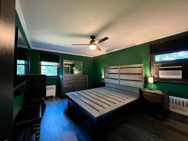 a view of a livingroom with furniture and a kitchen