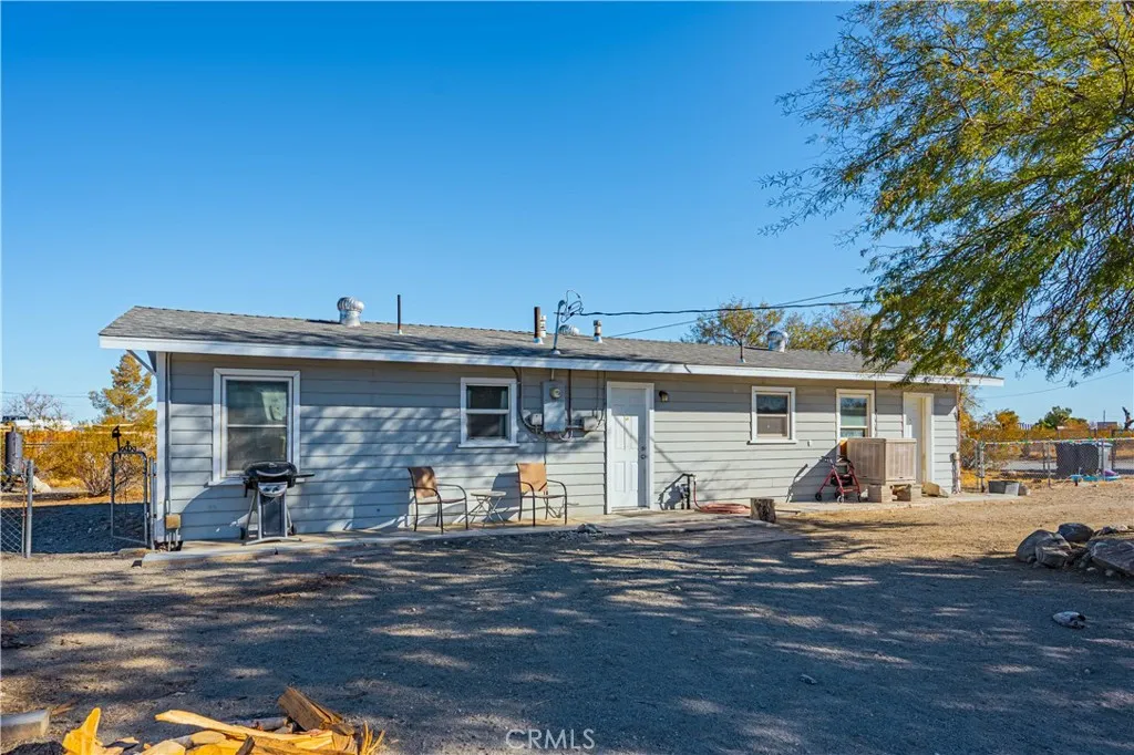 13550 Avondale Road, Unit 113 Phelan, CA 92371 - Photo 1 of 1 a front view of a house with a patio
