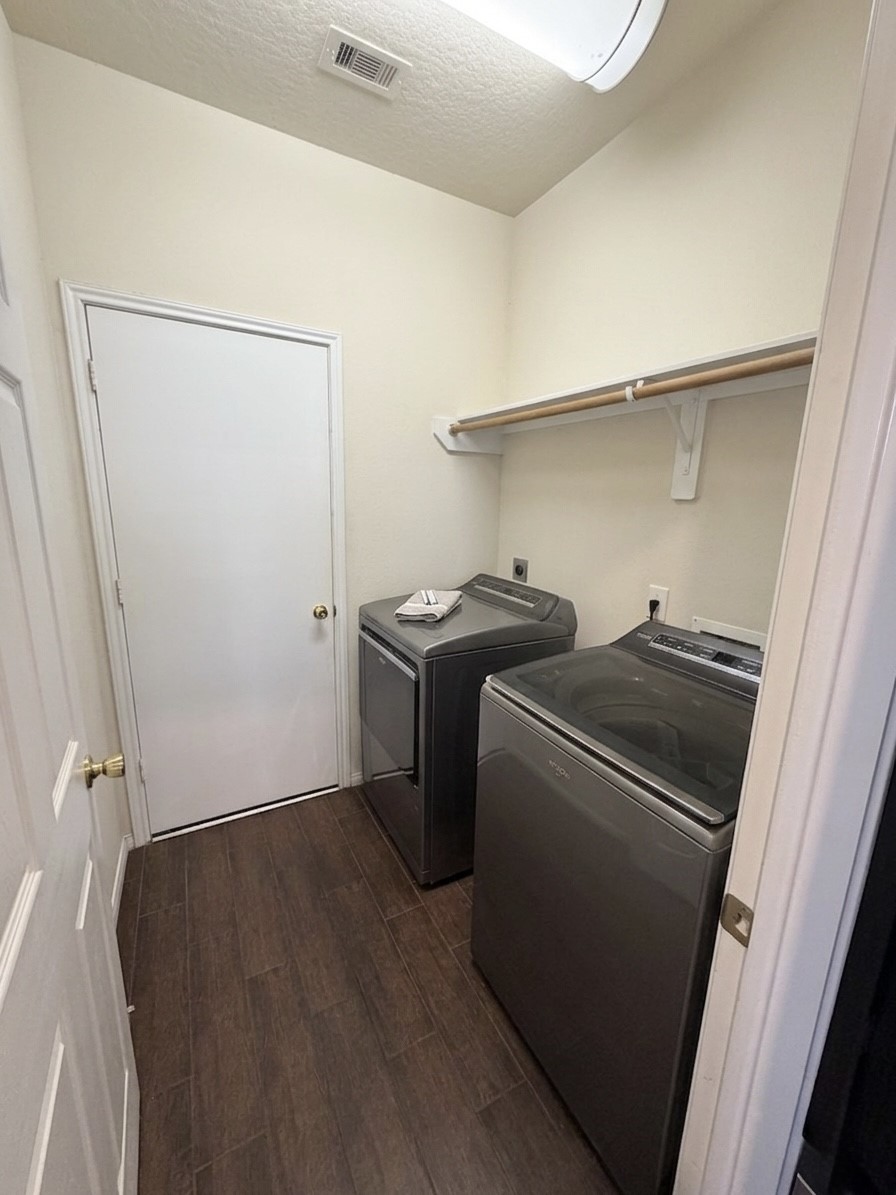 9908 Climbing Tree Street Conroe, TX 77385 - Photo 24 of 26 a utility room with dryer and washer
