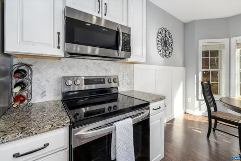 a kitchen with a stove and a microwave