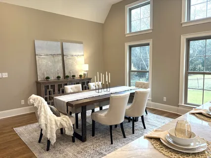 a kitchen with granite countertop a sink cabinets and stainless steel appliances