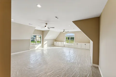 a view of yard with swimming pool and green space