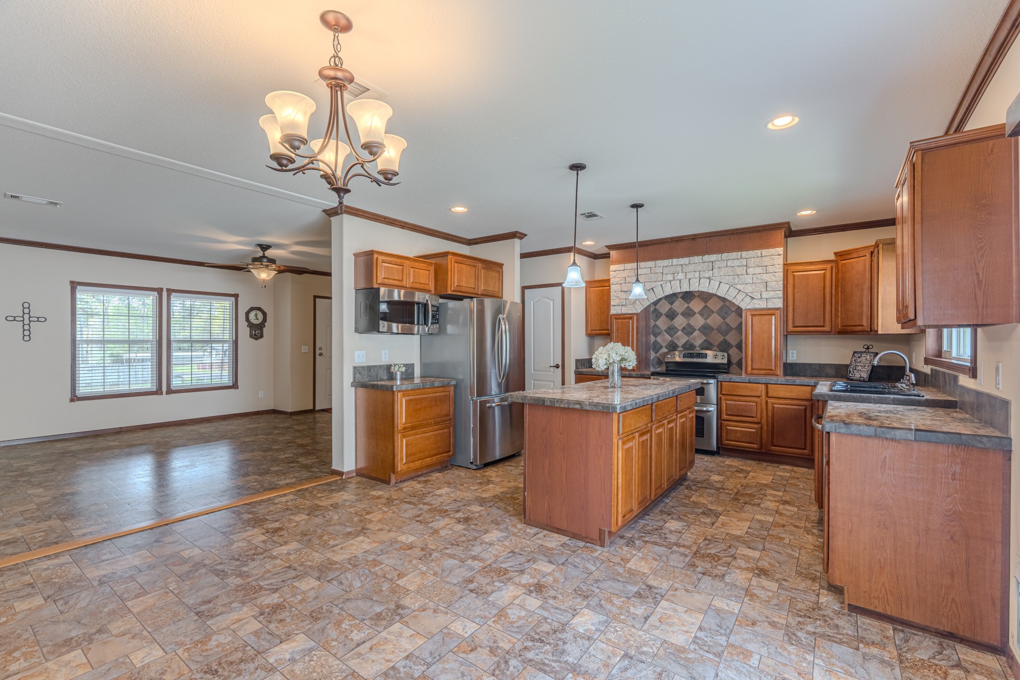 115 Canadian Drive Trinity, TX 75862 - Photo 11 of 42 Openness to a bright dining area with modern lighting, perfect for entertaining.