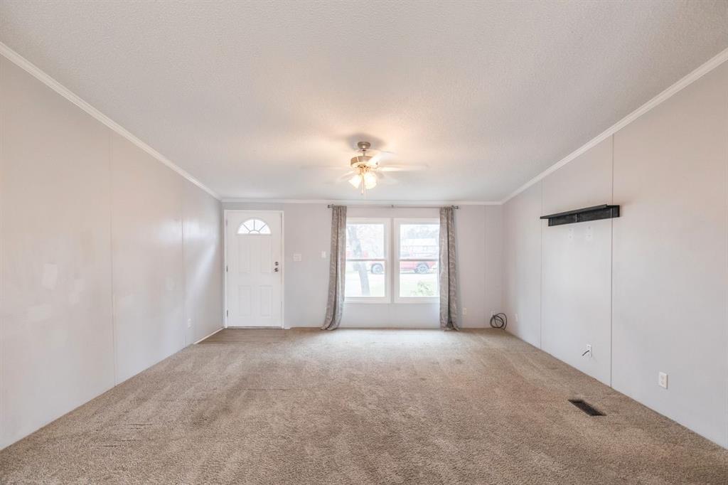 717 Marlin Street Clyde, TX 79510 - Photo 11 of 37 a view of an empty room with a window