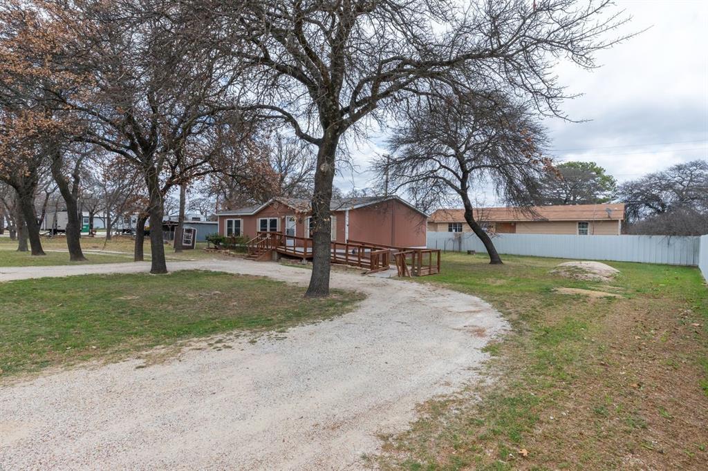 717 Marlin Street Clyde, TX 79510 - Photo 2 of 37 a view of yard with tree s