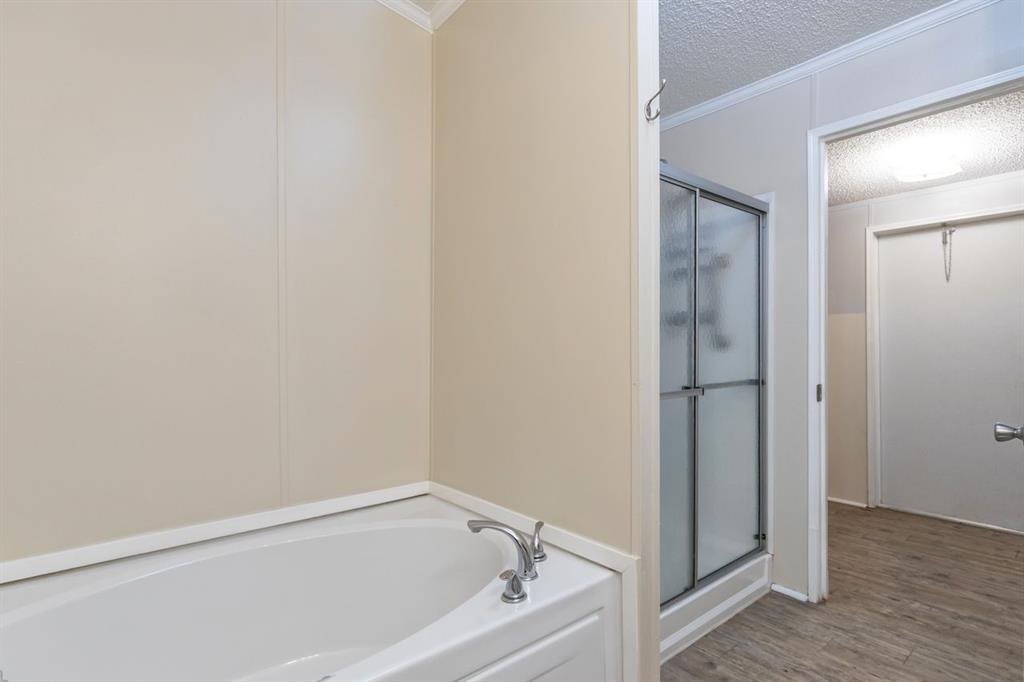 717 Marlin Street Clyde, TX 79510 - Photo 24 of 37 a bathroom with a tub
