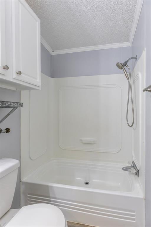 717 Marlin Street Clyde, TX 79510 - Photo 34 of 37 a bathroom with a shower and a toilet