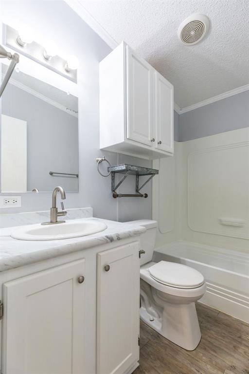 717 Marlin Street Clyde, TX 79510 - Photo 35 of 37 a bathroom with a sink a toilet and a mirror