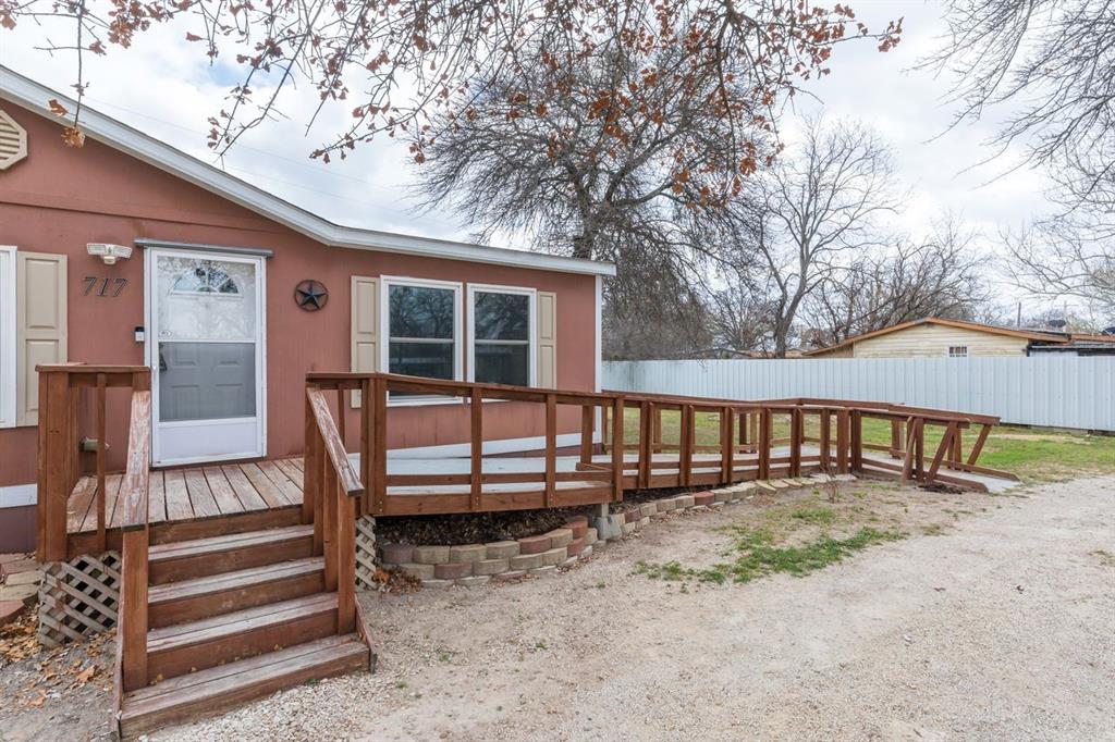 717 Marlin Street Clyde, TX 79510 - Photo 4 of 37 a view of a house with wooden deck and furniture