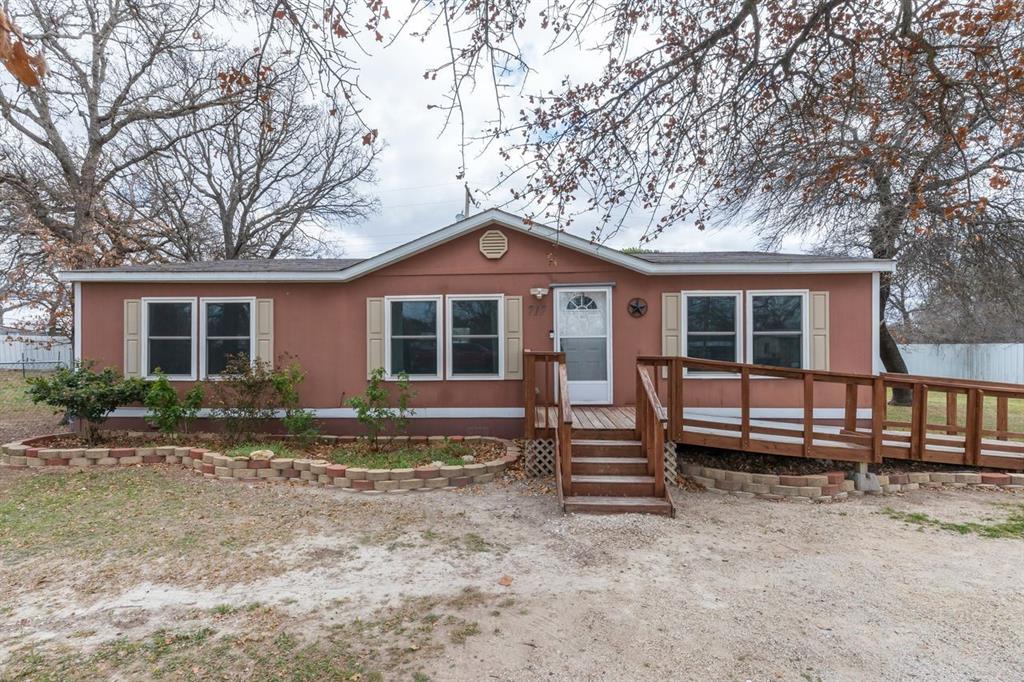 717 Marlin Street Clyde, TX 79510 - Photo 5 of 37 a front view of a house with a garden