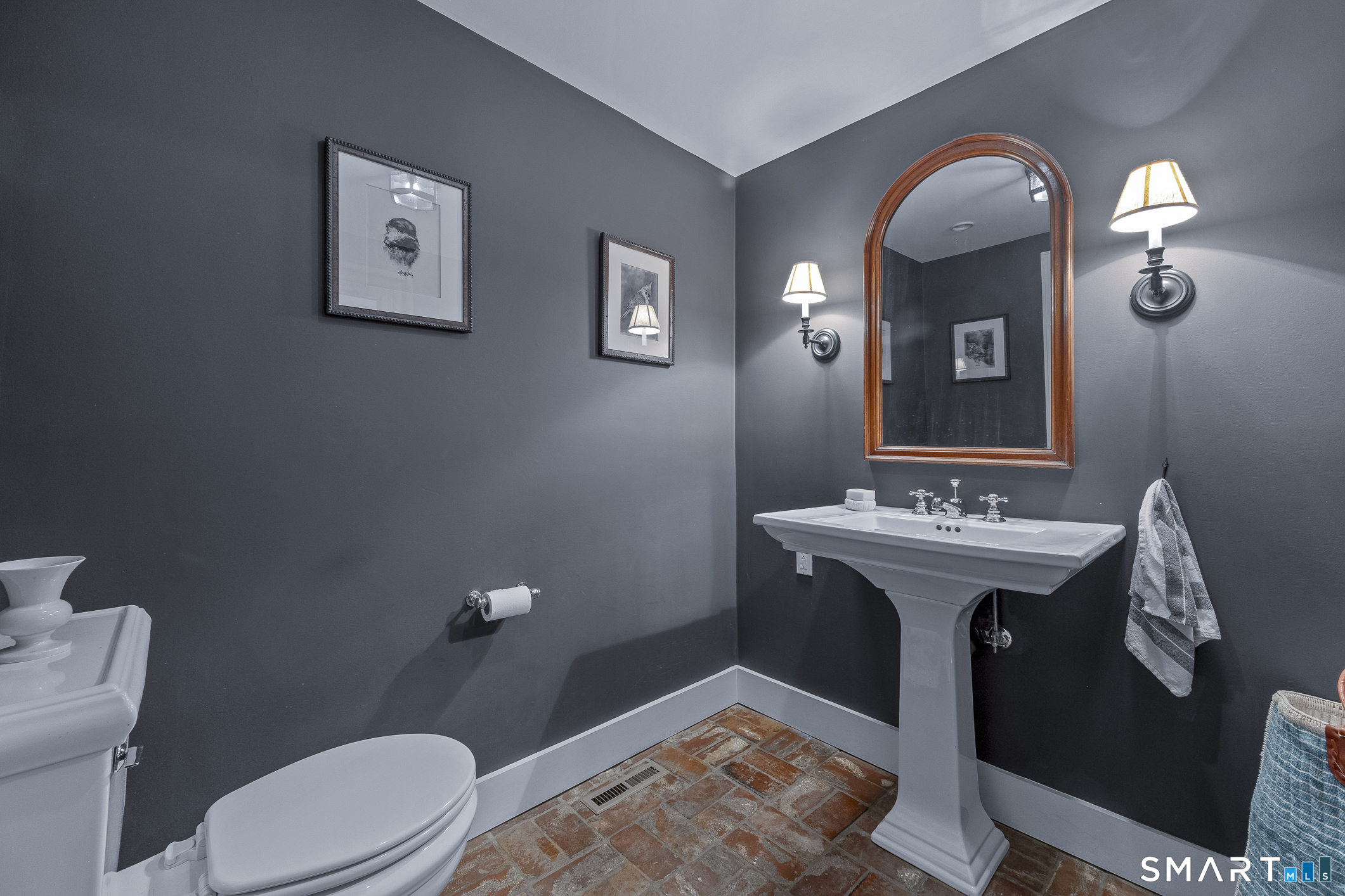 50 Warner Road Bridgewater, CT 06752 - Photo 13 of 27 a spacious bathroom with a toilet sink and mirror