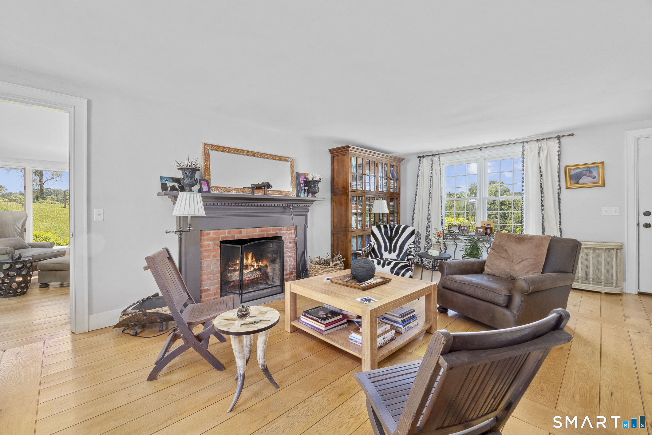 50 Warner Road Bridgewater, CT 06752 - Photo 15 of 27 a living room with furniture and a fireplace
