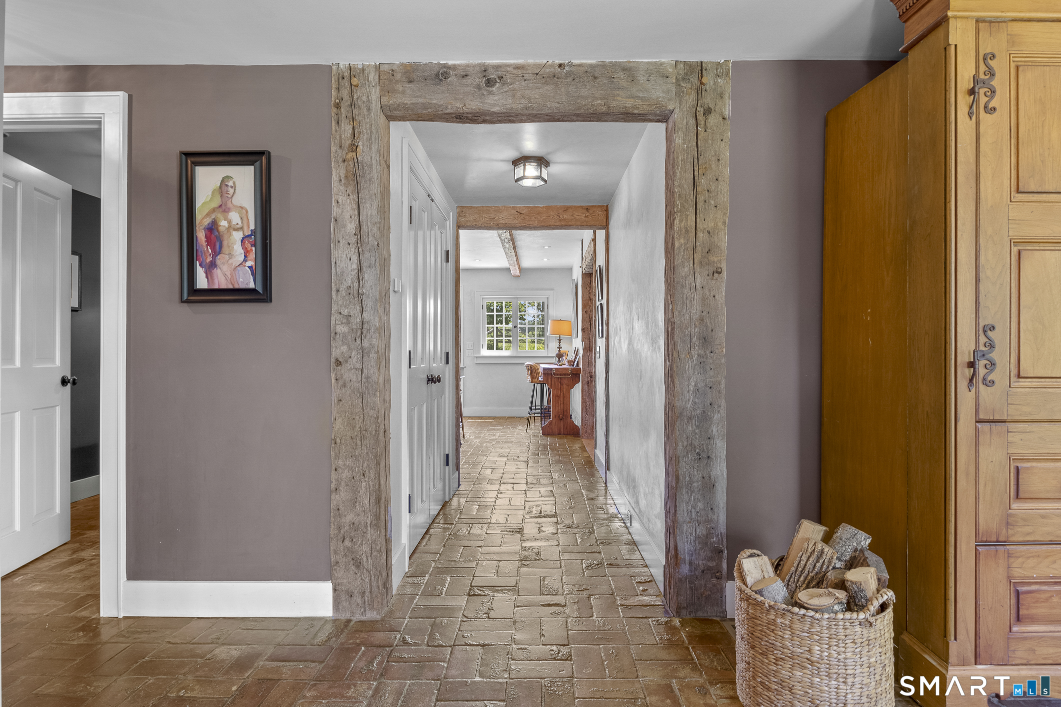 50 Warner Road Bridgewater, CT 06752 - Photo 8 of 27 a view of a hallway with wooden floor and a livingroom