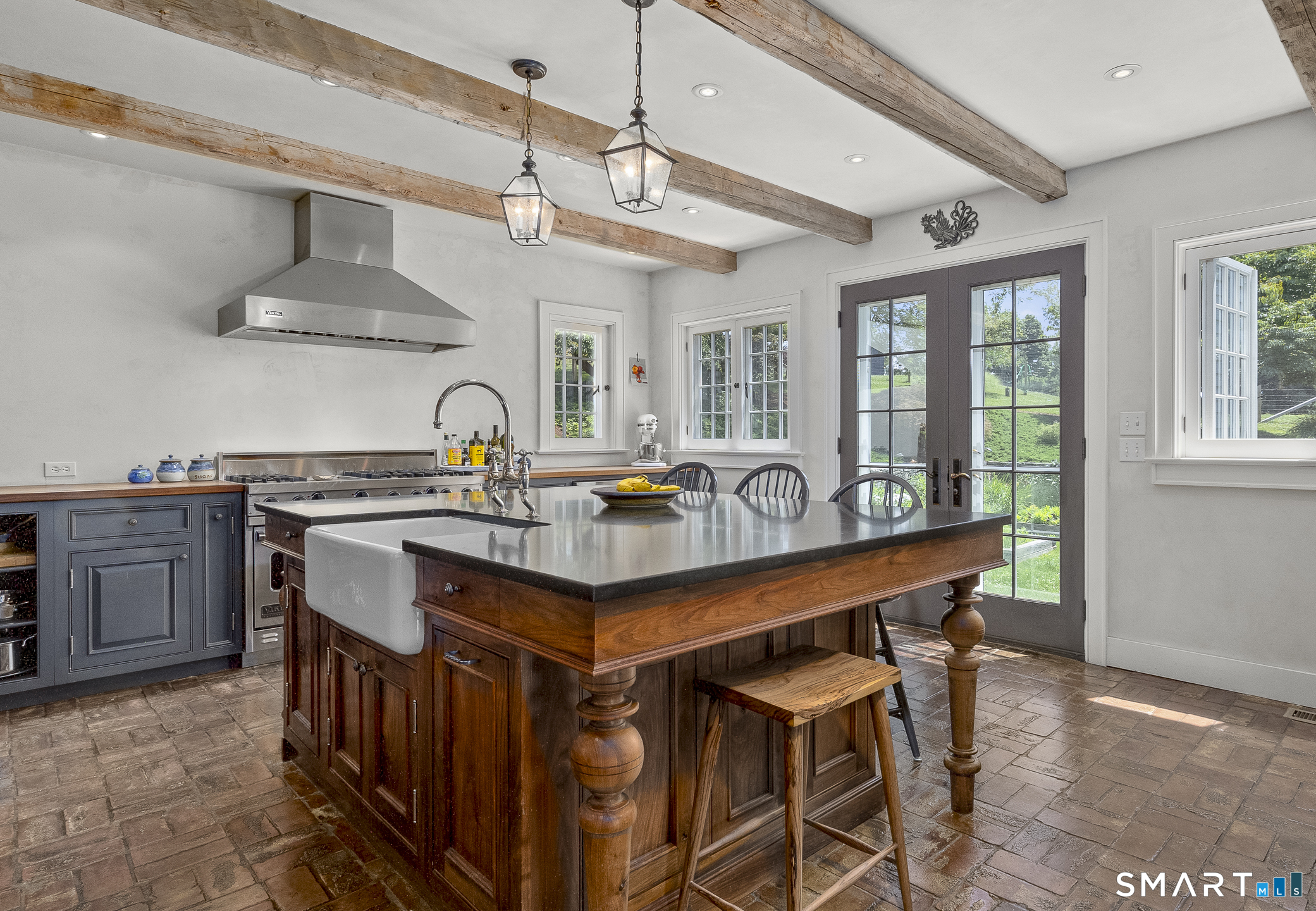 50 Warner Road Bridgewater, CT 06752 - Photo 9 of 27 a kitchen with a table chairs stove and cabinets