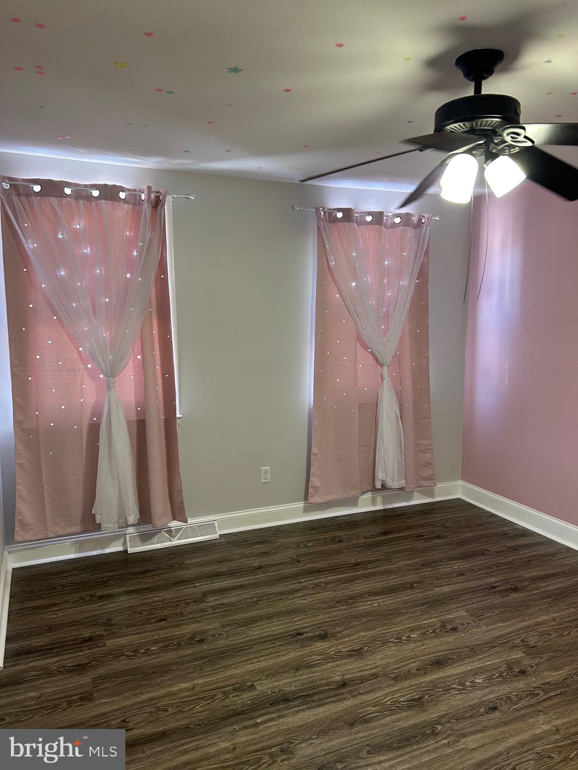 240 Purdue Avenue Pemberton, NJ 08068 - Photo 12 of 27 a view of an empty room with wooden floor and fan