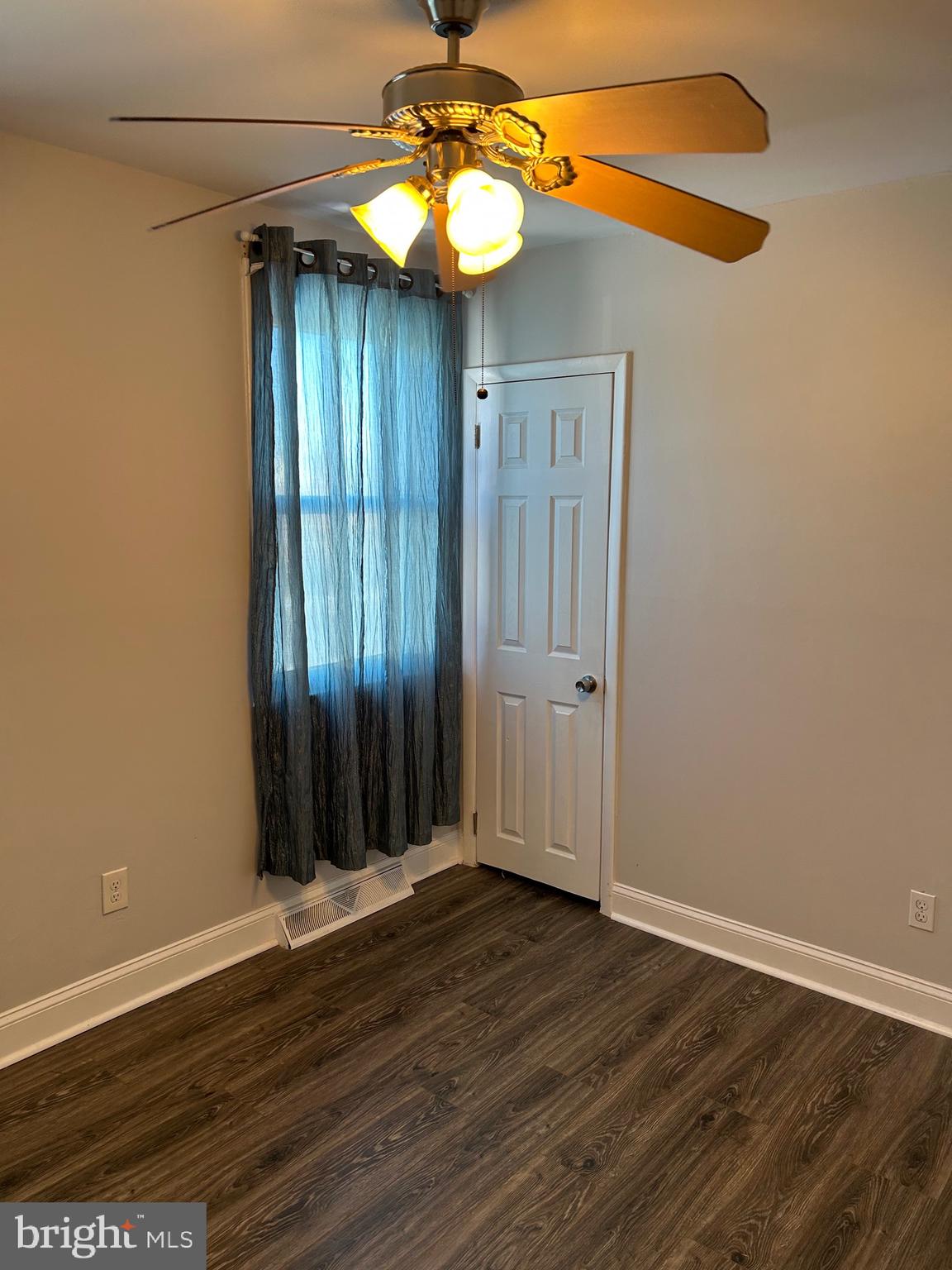 240 Purdue Avenue Pemberton, NJ 08068 - Photo 14 of 27 an empty room with wooden floor fan and window