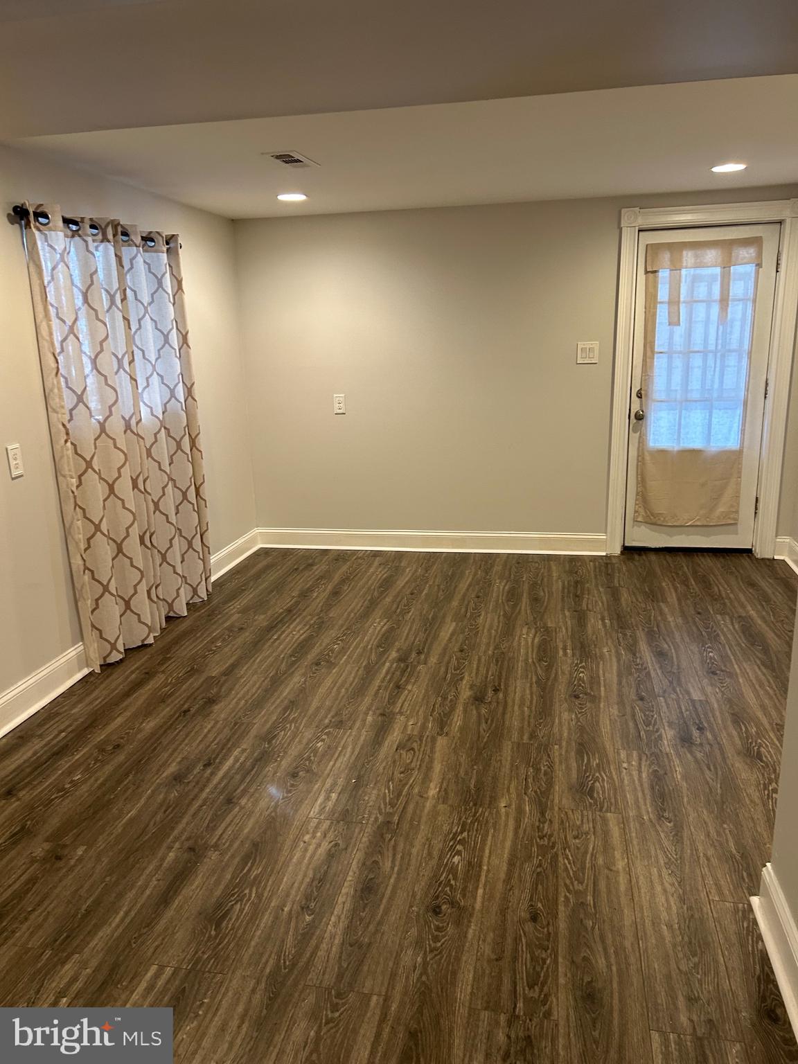 240 Purdue Avenue Pemberton, NJ 08068 - Photo 20 of 27 a view of an empty room with a window and wooden floor