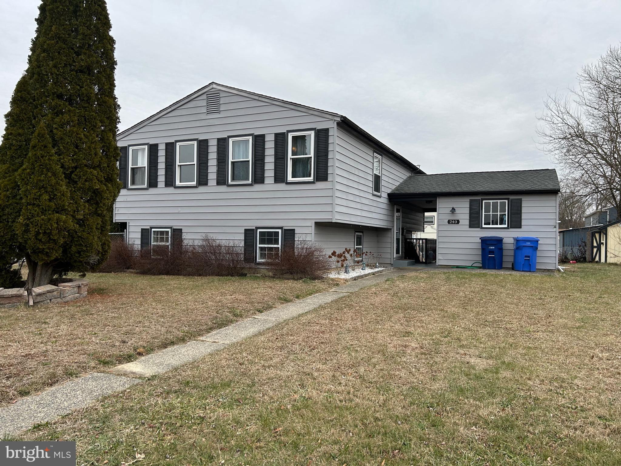 240 Purdue Avenue Pemberton, NJ 08068 - Photo 2 of 27 a front view of a house with a yard and garage