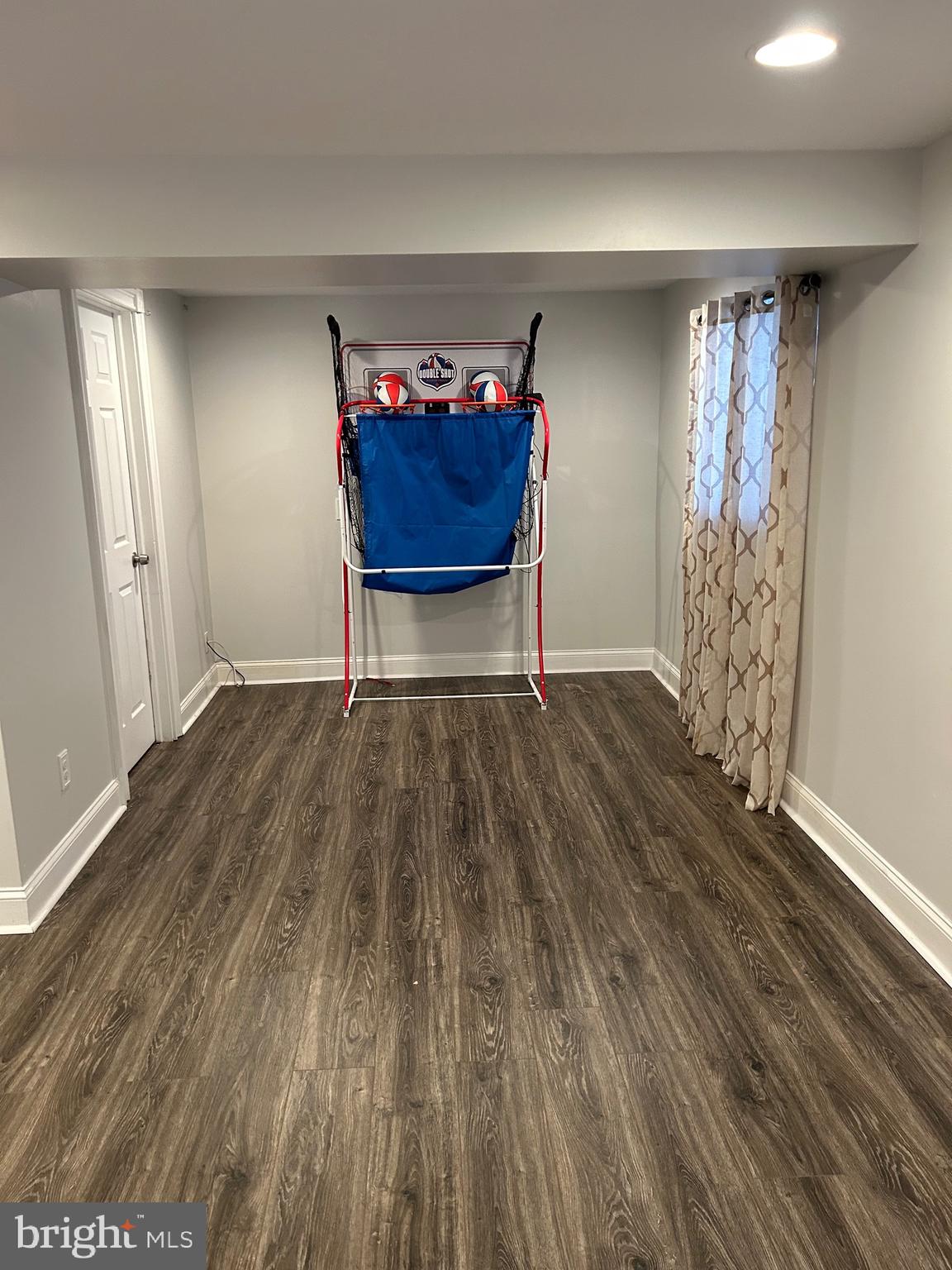 240 Purdue Avenue Pemberton, NJ 08068 - Photo 21 of 27 a view of an empty room with wooden floor and a window