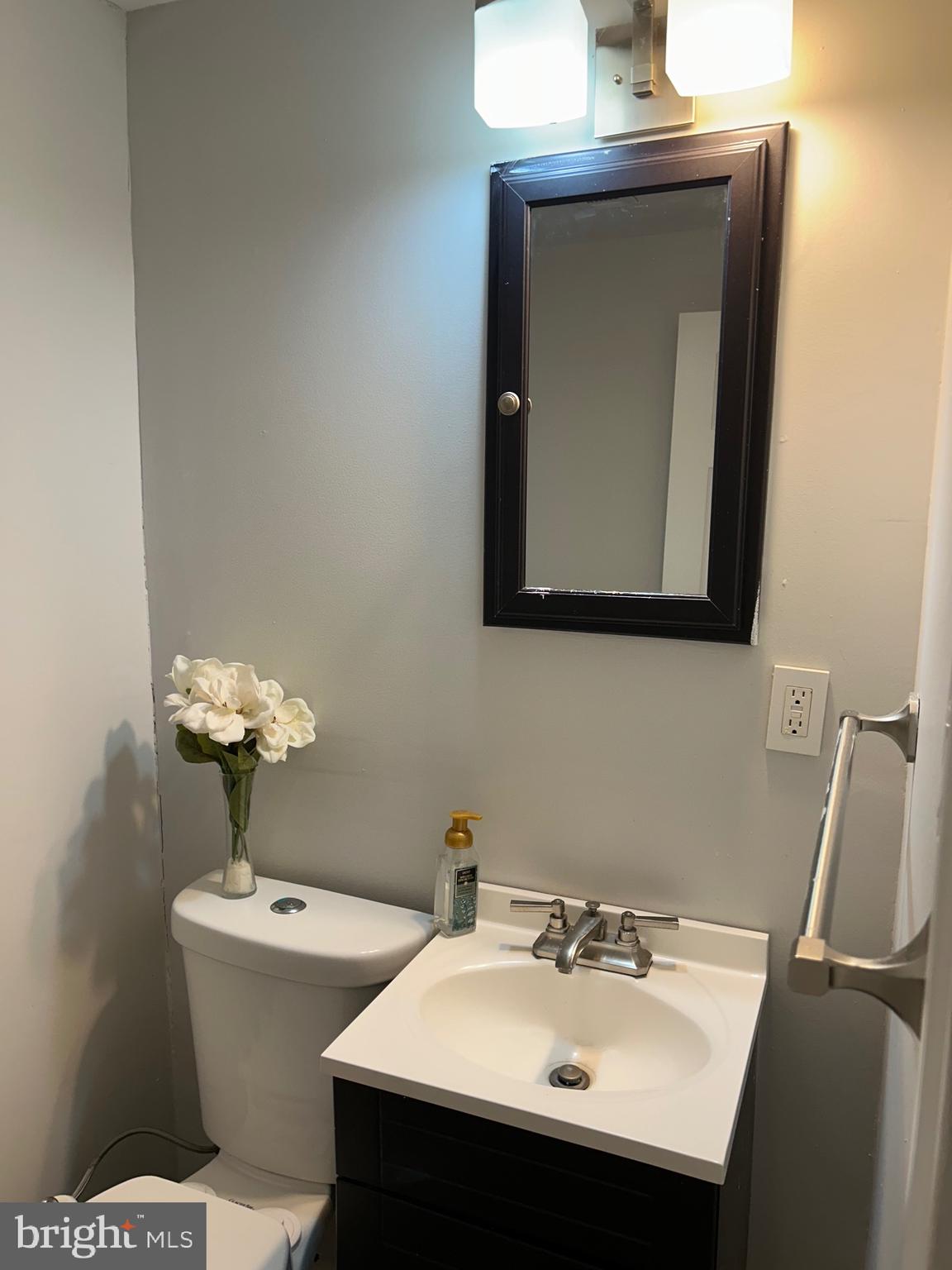 240 Purdue Avenue Pemberton, NJ 08068 - Photo 26 of 27 a bathroom with a sink a mirror and a toilet
