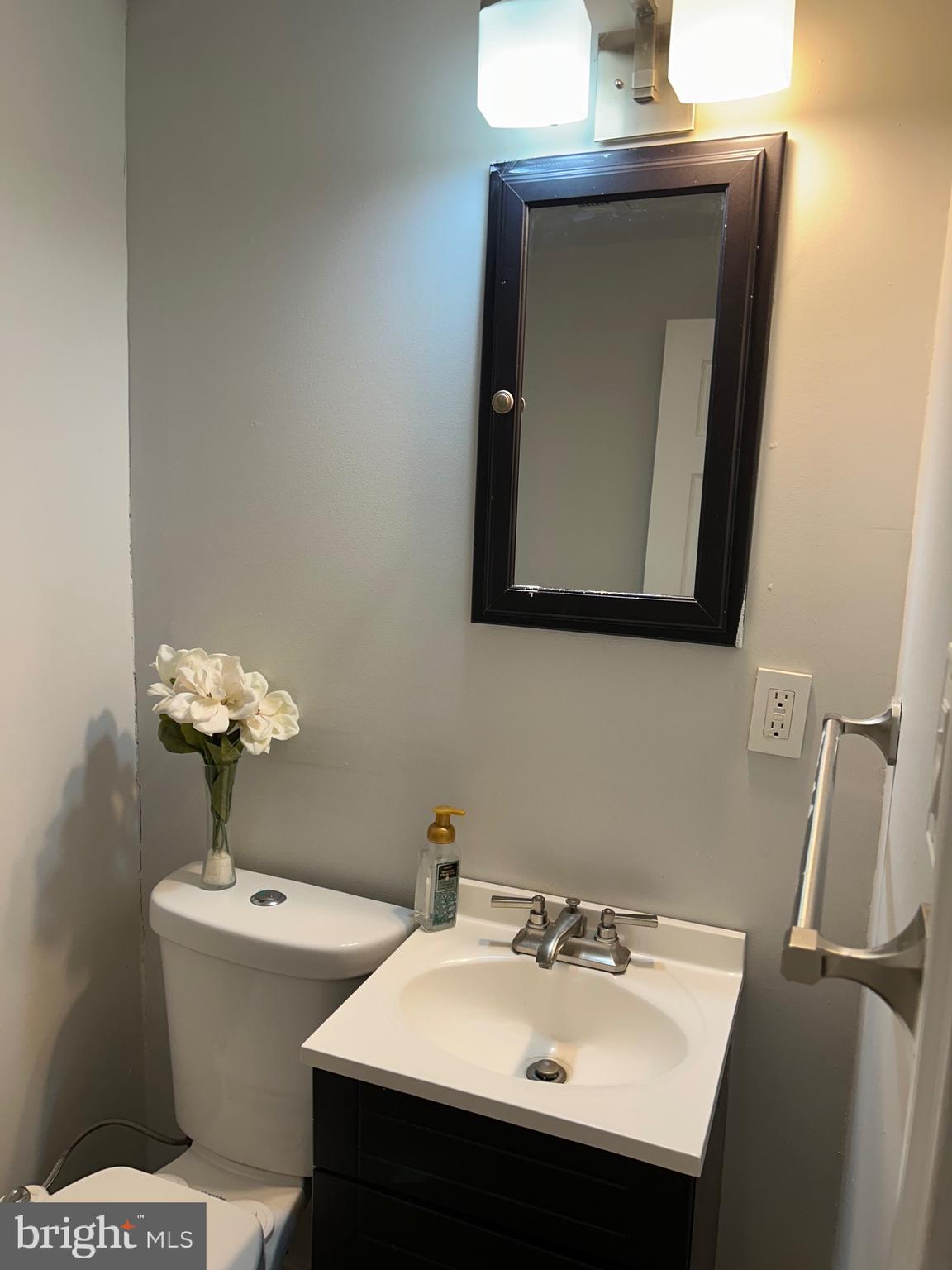 240 Purdue Avenue Pemberton, NJ 08068 - Photo 27 of 27 a bathroom with a sink toilet and mirror