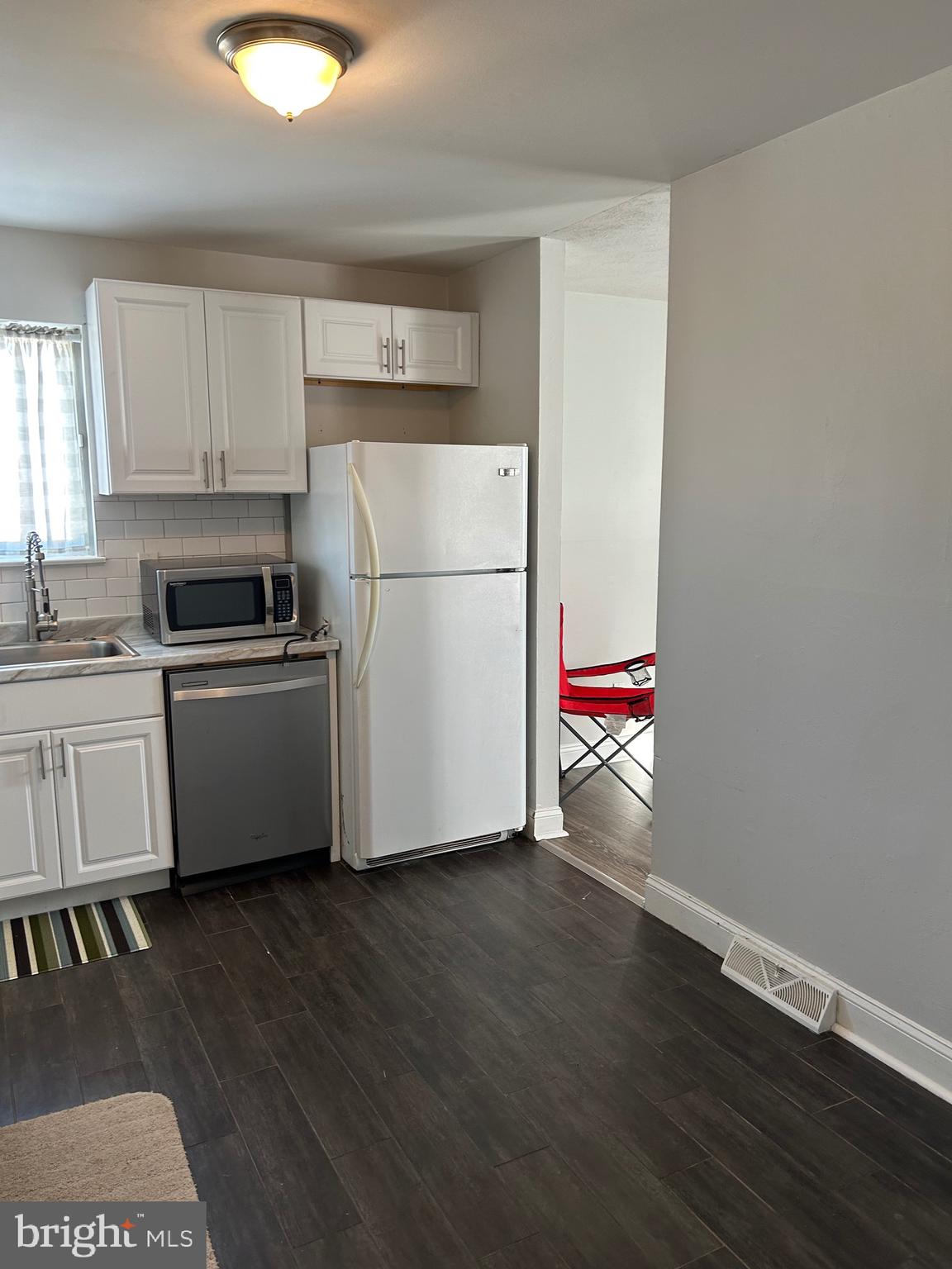 240 Purdue Avenue Pemberton, NJ 08068 - Photo 7 of 27 a kitchen with granite countertop a refrigerator and a sink