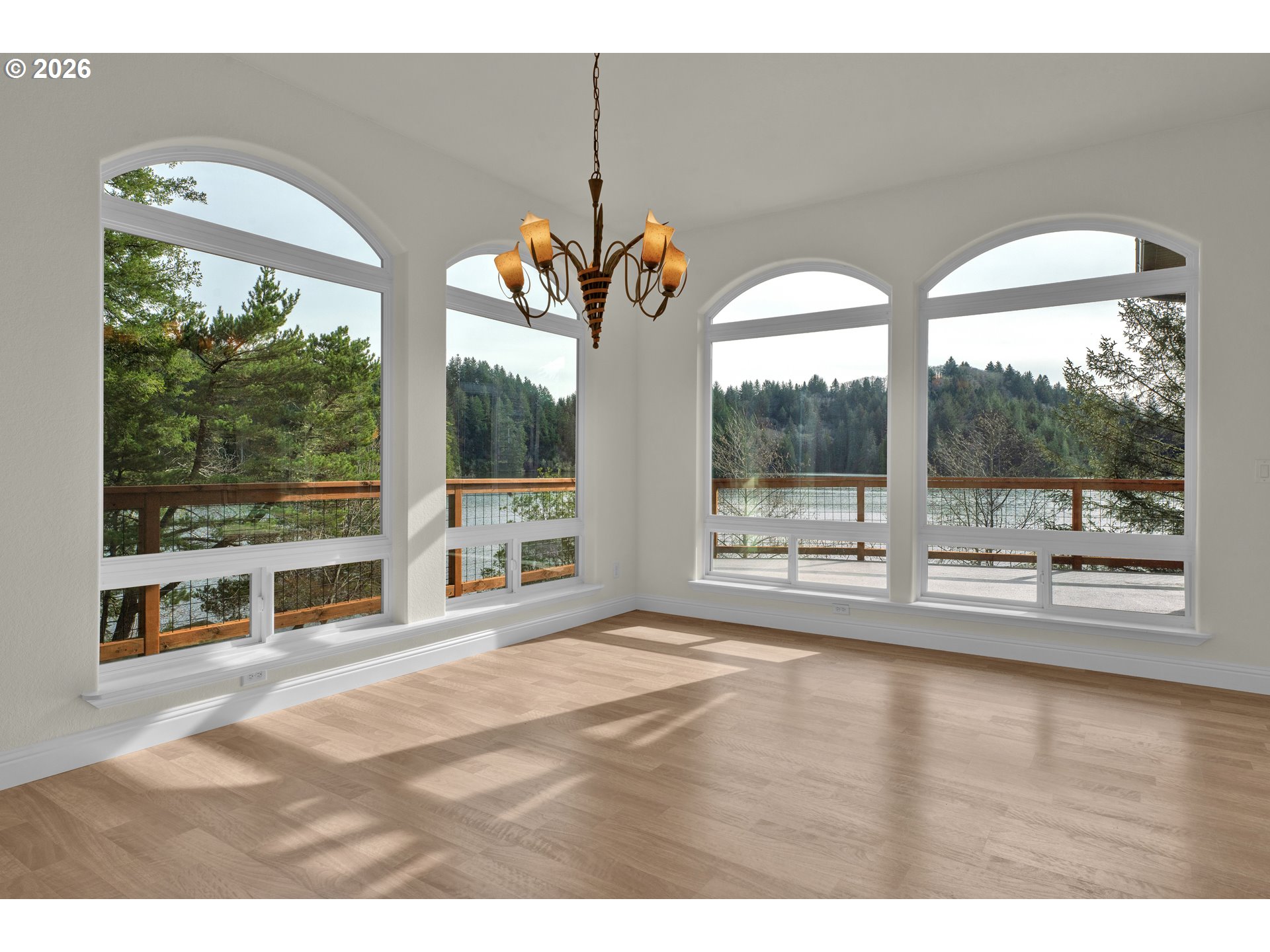 5816 Martin Road Florence, OR 97439 - Photo 23 of 47 a living room with a large window and a table