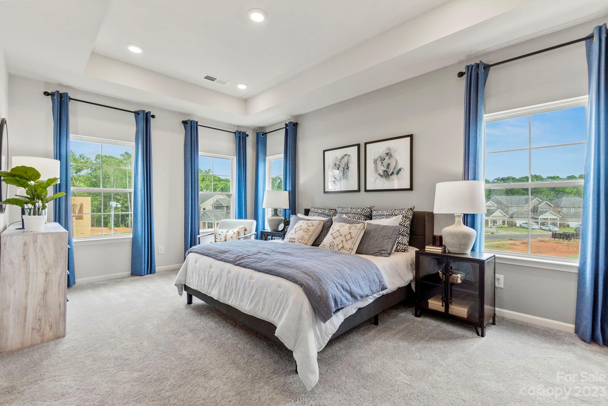 7856 Nelson Road Mint Hill, NC 28227 - Photo 12 of 30 a spacious bedroom with a large bed and a large window