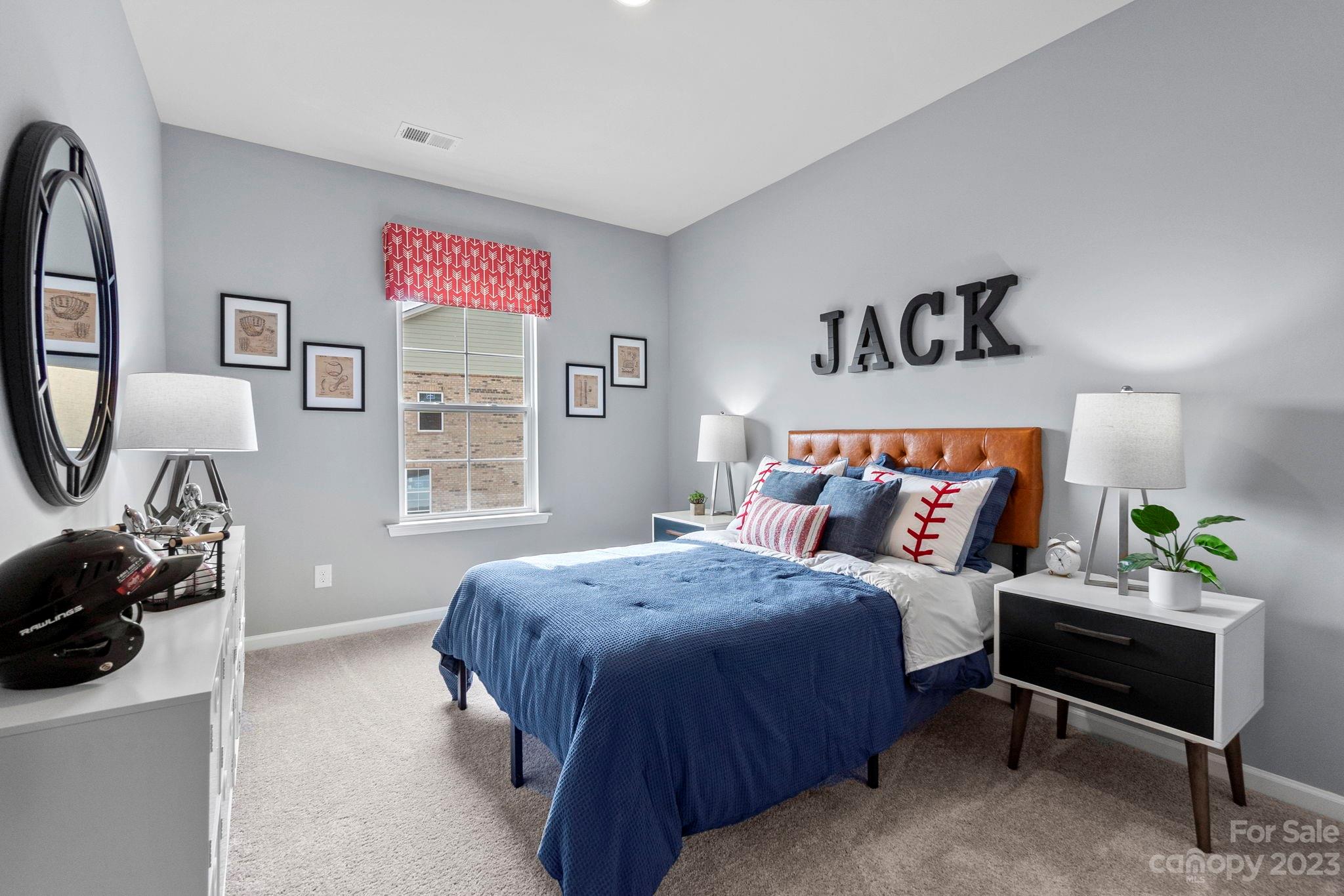 7856 Nelson Road Mint Hill, NC 28227 - Photo 17 of 30 a bedroom with a bed and a couch