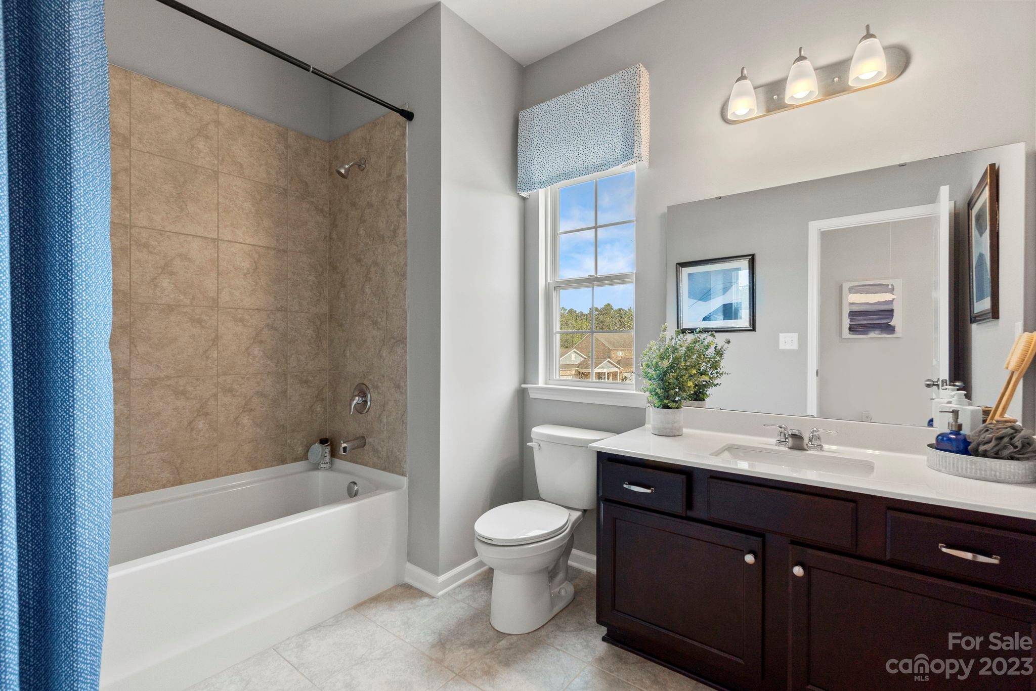 7856 Nelson Road Mint Hill, NC 28227 - Photo 18 of 30 a bathroom with a sink a toilet and shower