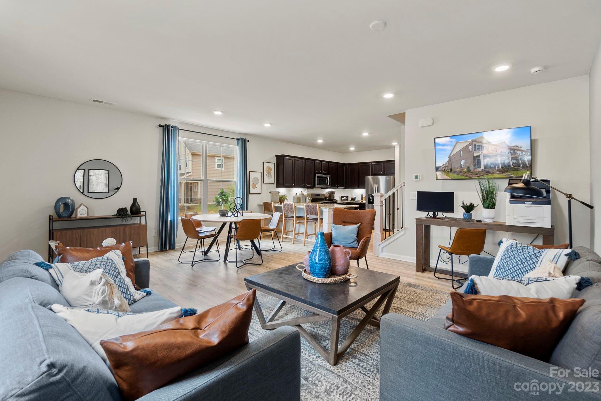 7856 Nelson Road Mint Hill, NC 28227 - Photo 5 of 30 a living room with furniture and a flat screen tv