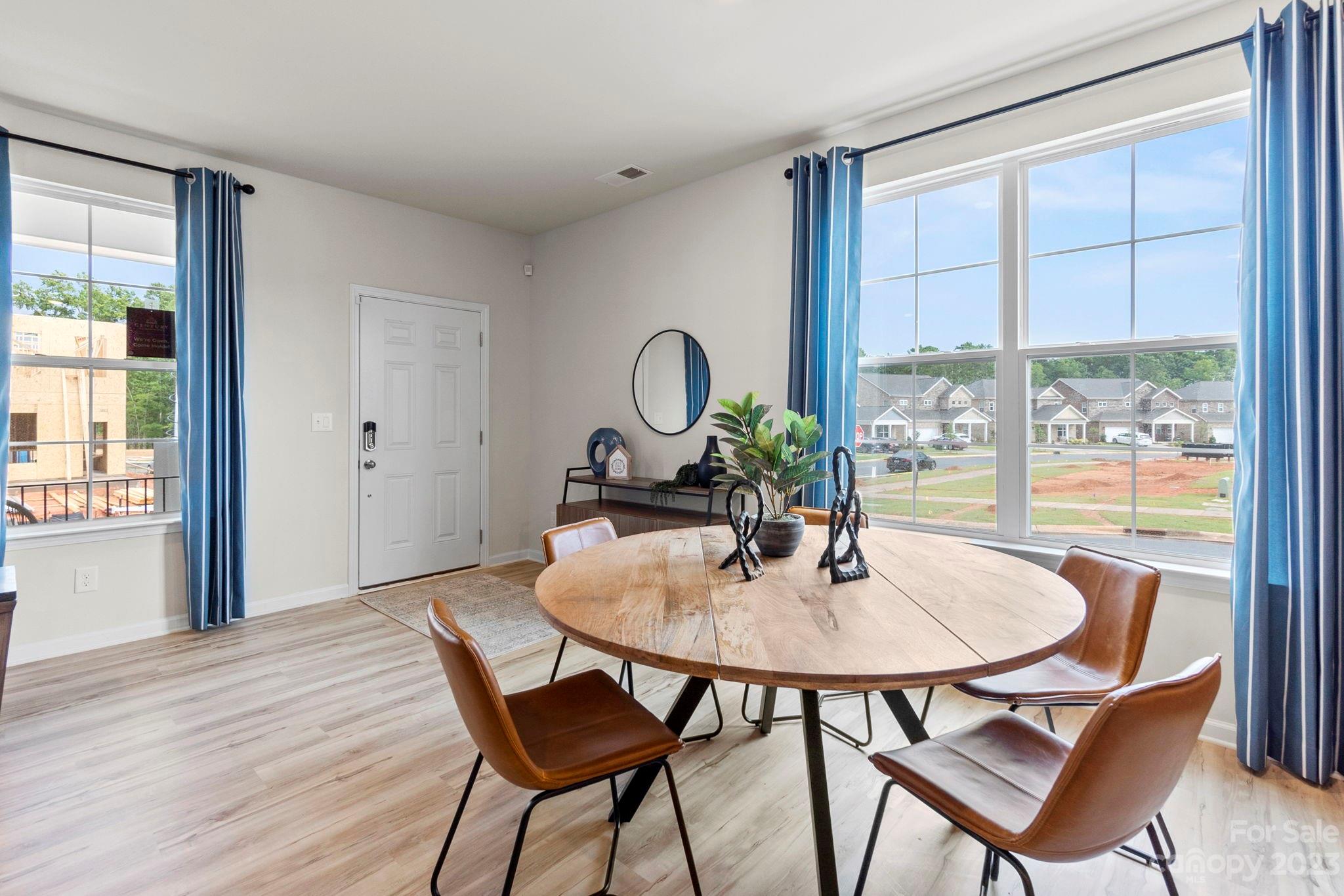 7856 Nelson Road Mint Hill, NC 28227 - Photo 6 of 30 a dining room with furniture and wooden floor