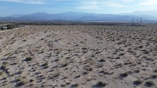 a view of beach and a field