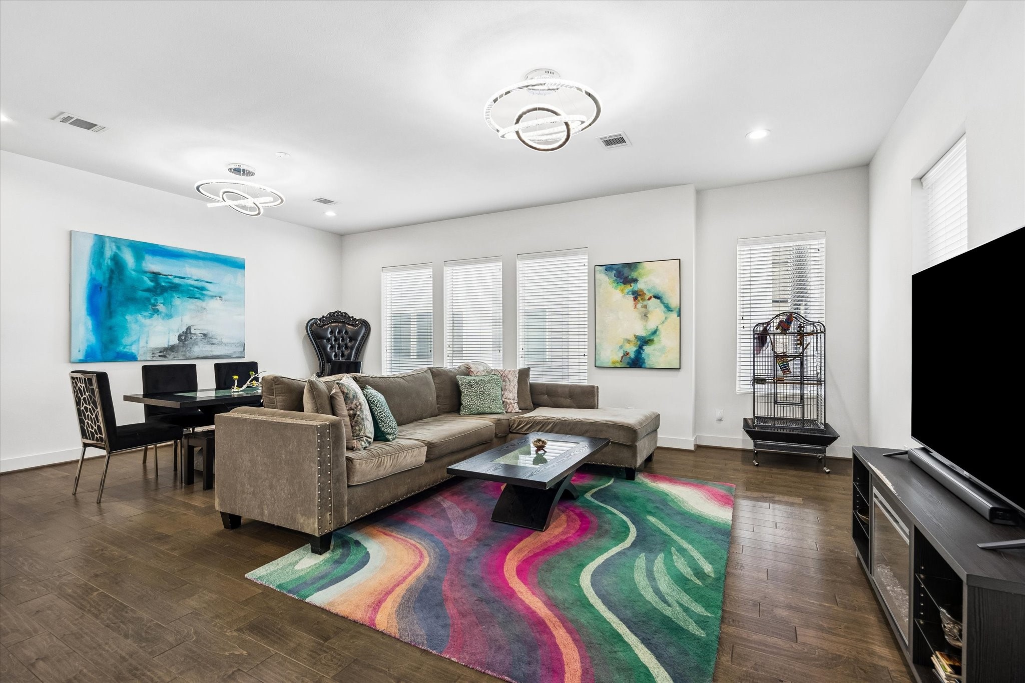 1310 Hussion Street Houston, TX 77003 - Photo 6 of 34 This open concept living room features modern lighting, hardwood floors, and abundant natural light from multiple windows.