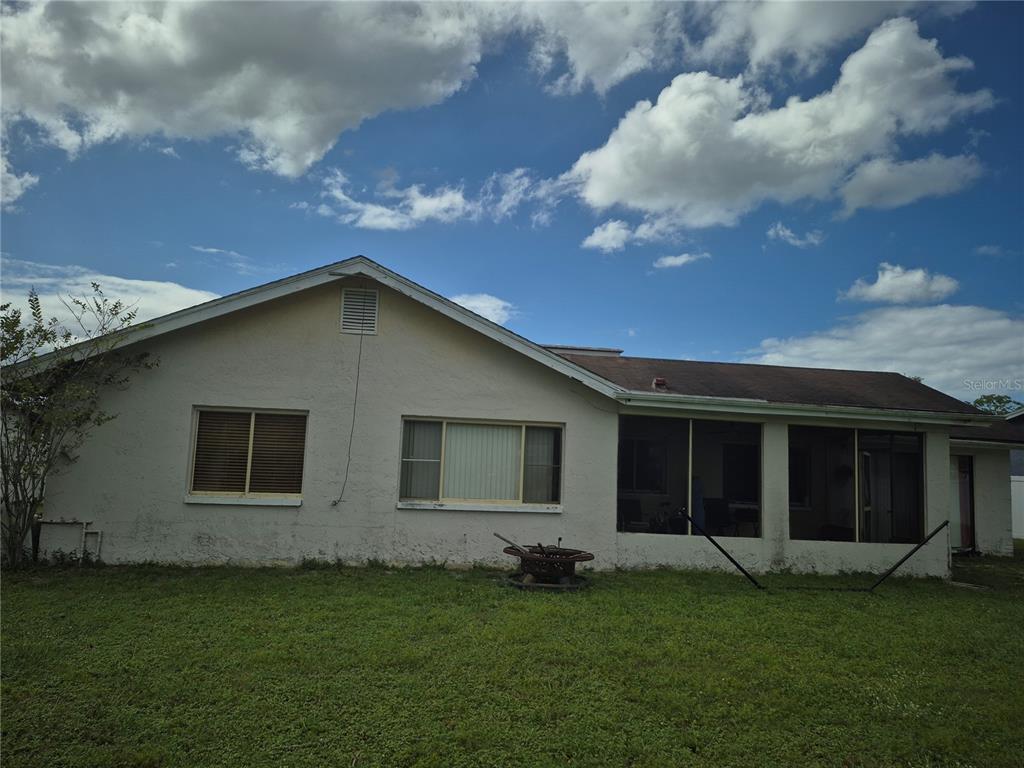 13710 Whitby Road Hudson, FL 34667 - Photo 19 of 21 a view of a backyard with plants and a garden