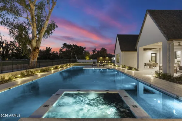 a view of swimming pool with lounge chair