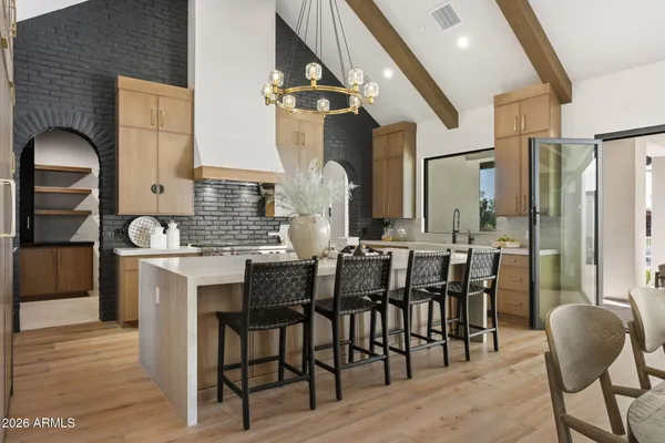 a living room with fireplace furniture and a floor to ceiling window