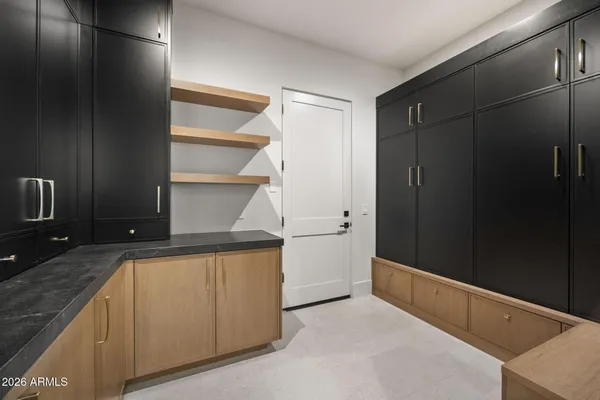 an empty room with windows and closet